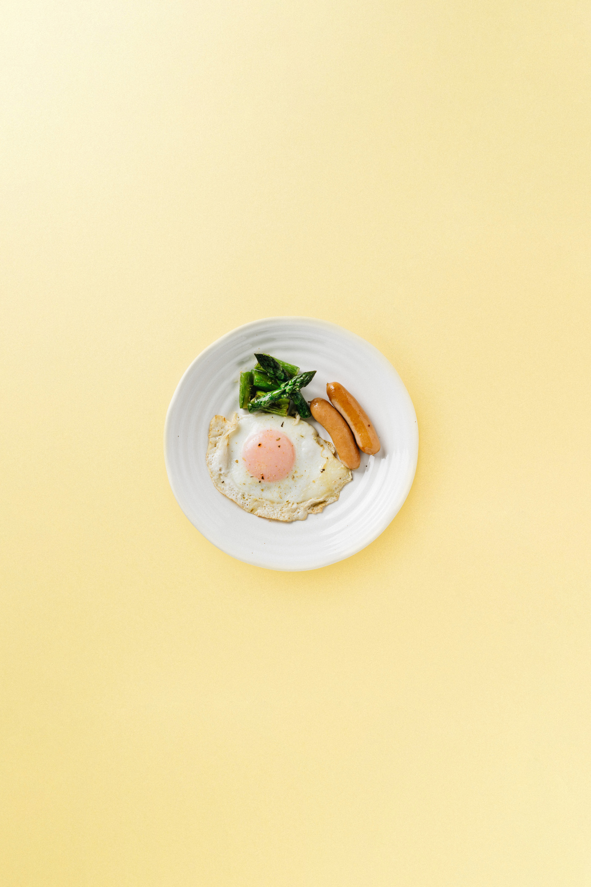 Sausages and Egg on a Plate Flatlay